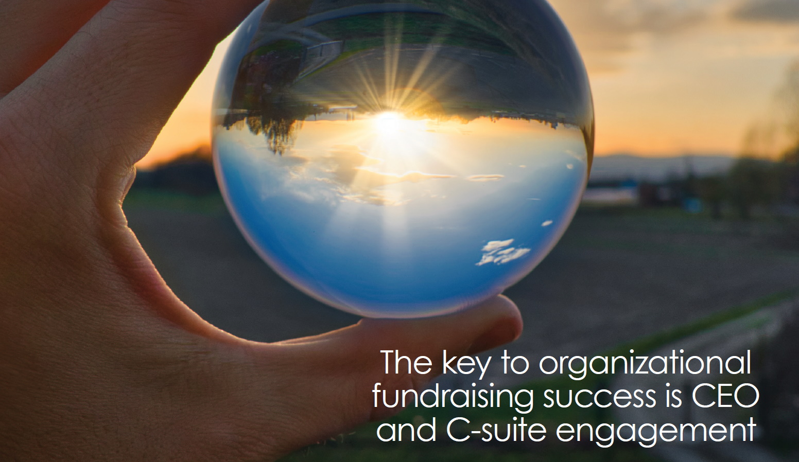 Image of glass globe with sun in background and text in front. Hospital Fundraising. Executive Coach for Corporate CEOs and C-Suite Executives in Boston MA Peter Gosline.